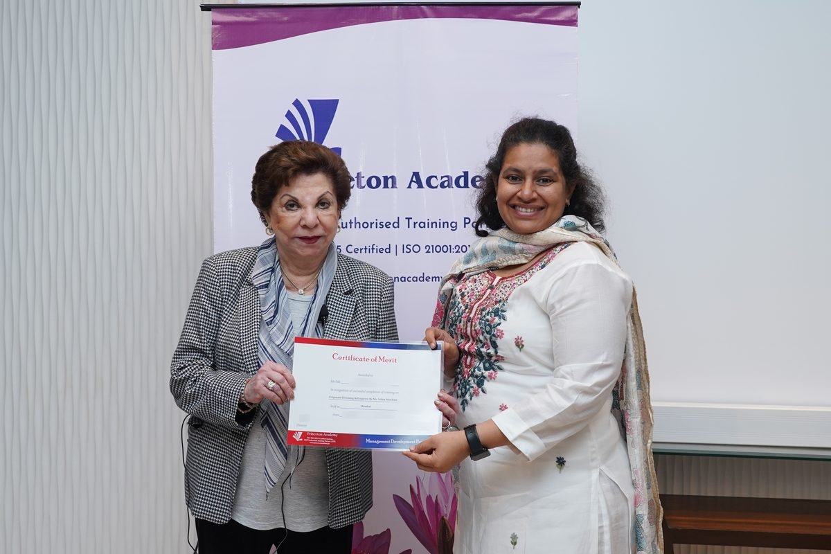 Sabira Merchant presenting a certificate to a participant
