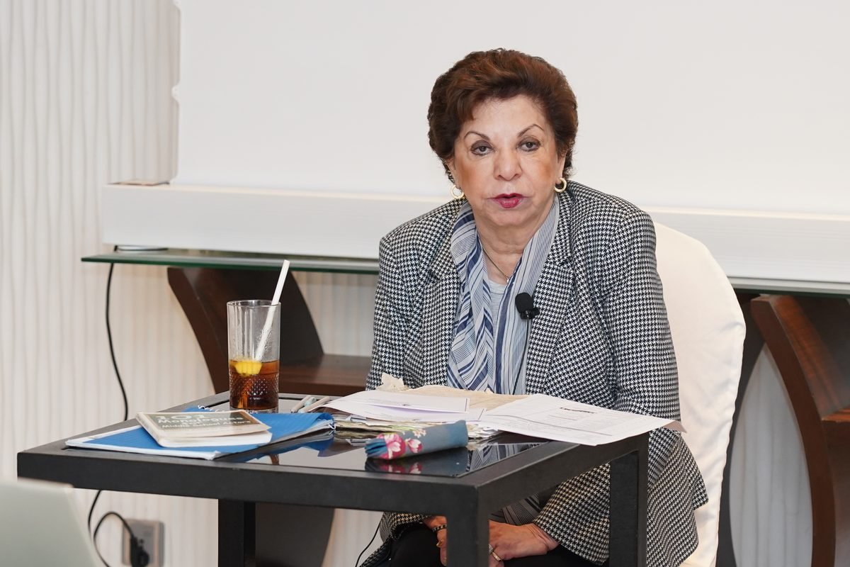 Sabira Merchant addressing participants from her table
